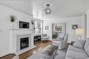 a living room with a couch and a fireplace at Modern Gem in Columbia in Columbia