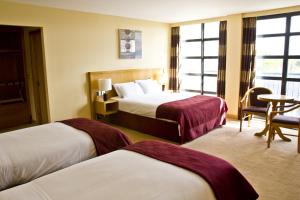 Voodi või voodid majutusasutuse Upton Court Hotel toas