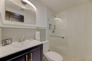 a bathroom with a sink and a toilet and a shower at Double-Suite Apartment Home in Columbia +14 photos