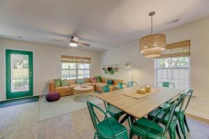 a dining room and living room with a table and chairs at A Sunny Stylish 4BR 3BA in West Columbia