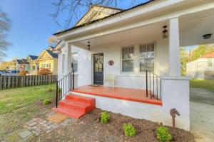 a white house with a red porch and stairs at Peaceful 3BR in DT Columbia in Columbia