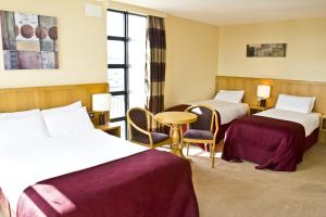 Voodi või voodid majutusasutuse Upton Court Hotel toas