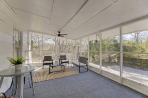 an empty room with a table and chairs and windows at Quaint 1 BR Apt Min from USC in Columbia