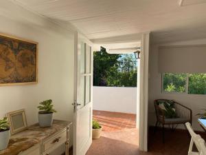 an open door to a patio with a table and a chair at Ubicación Vista Cochera Wifi full in Mendoza +38 photos
