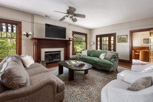 a living room with two couches and a fireplace at De La Vina Inn in Santa Barbara