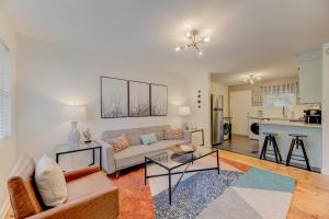 a living room with a couch and a table at Modern Renovated Apartment in Columbia