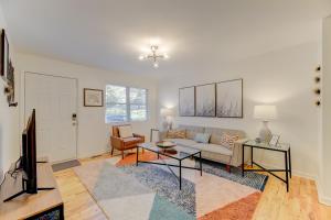 a living room with a couch and a tv at Modern Renovated Apartment in Columbia