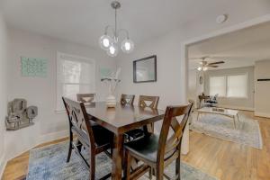 a dining room with a wooden table and chairs at Carolina Crash Pad Downstairs in Columbia