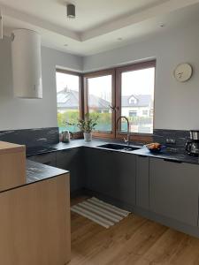 a kitchen with a sink and a counter at MARS HOME in Kołobrzeg