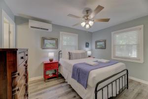 a bedroom with a bed and a ceiling fan at Ft. Jackson Family Abode in Columbia