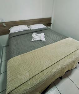 Postel nebo postele na pokoji v ubytování PORTAL PARQUE HOTEL