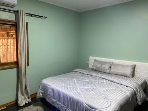Ένα ή περισσότερα κρεβάτια σε δωμάτιο στο Shamwari’s Guest