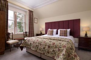 a hotel room with a large bed and a window at No 45, Ballater in Ballater