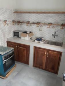 Kuchyň nebo kuchyňský kout v ubytování Grand studio à 100 m de la plage