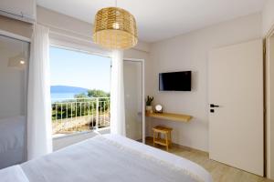 Postel nebo postele na pokoji v ubytování Paradise Villas