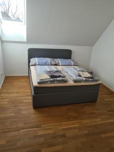 a bed sitting in a corner of a room at GardenLoft no4 - enjoy in Vienna