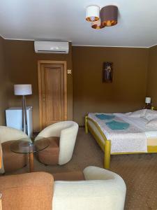 A bed or beds in a room at Penzion Jople