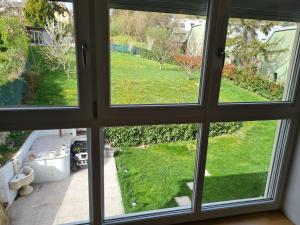 a view from a window of a yard at GardenLoft no4 - enjoy in Vienna