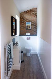 a bathroom with a sink and a toilet at The Kennels in Hexham