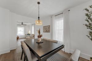 a dining room with a table and chairs at Charming Retreat - Close to Zoo and Downtown in Omaha