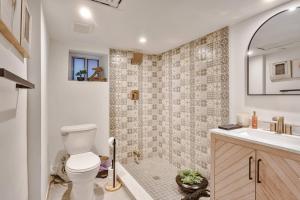 a bathroom with a toilet and a sink at Exquisite Luxury Estate - Steps to Downtown in Toronto