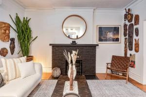 a living room with a fireplace and a mirror at Exquisite Luxury Estate - Steps to Downtown in Toronto