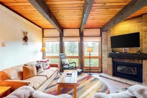 a living room with a couch and a fireplace at Lodge at Steamboat C107 in Steamboat Springs