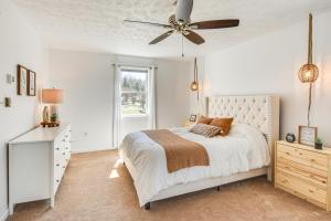 a bedroom with a bed and a ceiling fan at Massive and Modern Coudersport Getaway on 23 Acres! in Coudersport