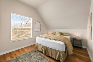 a bedroom with a bed and a window at Bright and Stylish Home - Great Central Location! in Timnath +19 photos