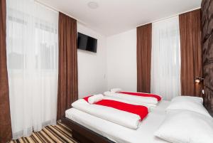 Postel nebo postele na pokoji v ubytování ParkCity rooms