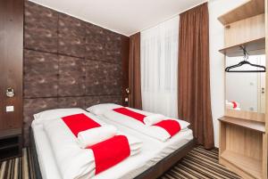 Postel nebo postele na pokoji v ubytování ParkCity rooms