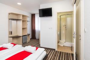 Postel nebo postele na pokoji v ubytování ParkCity rooms