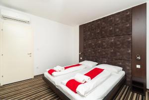 Postel nebo postele na pokoji v ubytování ParkCity rooms