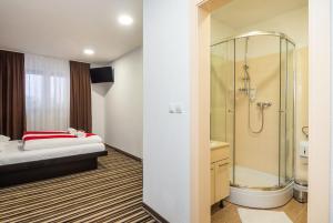 Postel nebo postele na pokoji v ubytování ParkCity rooms