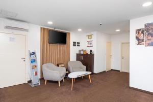 TV a/nebo společenská místnost v ubytování ParkCity rooms