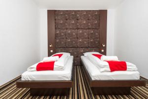 Postel nebo postele na pokoji v ubytování ParkCity rooms