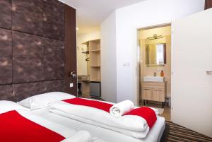 Postel nebo postele na pokoji v ubytování ParkCity rooms