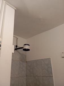 a bathroom with a shower and a ceiling at Goya'sHostel in Camaná