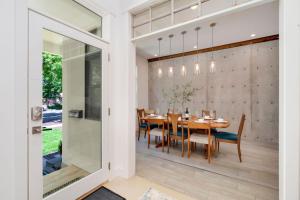 a dining room with a table and chairs at Old Town Oasis - Spacious Artisan Home in Old Town in Fort Collins