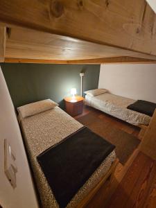 Tempat tidur dalam kamar di Rifugio Guglielmo e Giovanni Pelizzo