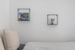 Letto o letti in una camera di Gellerico Rooms at Deák Square