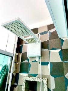 a room with a tile floor and a stair case at Studio 219 em Santos in Santos