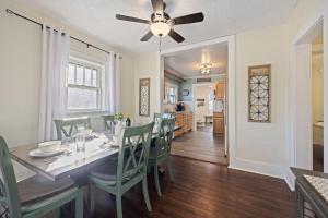 a dining room and kitchen with a table and chairs at Newly Renovated in the Heart of Historic Loveland in Loveland