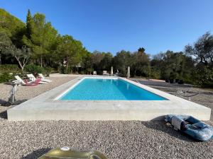 a swimming pool in the middle of a yard at Tenuta Palmarini in San Cataldo