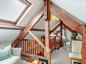 a loft conversion with wooden beams and a skylight at 3 bed in Okehampton 49513 in Sampford Courtenay