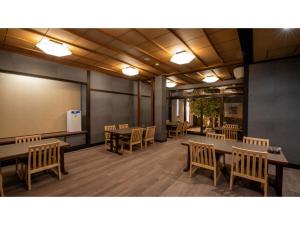 a conference room with tables and chairs and a whiteboard at Taiheian - Vacation STAY 57298v in Sakai