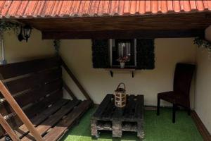 a room with a table and a chair and a window at L'appel de la forêt in Quincy-sous-Sénart