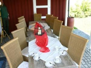 a table with a red cloth on top of it at Haus Hermann in Presseck