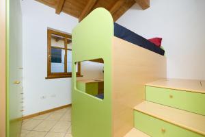 a bedroom with a bed with a surfboard on it at A Casa di Anna Maria in Brenzone sul Garda