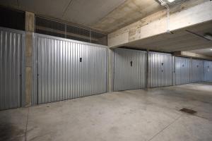 an empty parking garage with metal garage stalls at A Casa di Anna Maria in Brenzone sul Garda